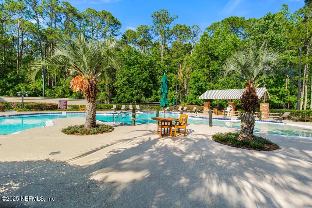 555 Hedgewood Drive St. Augustine, FL 32092 - Photo 65 of 70 a view of a park with bench and a bench