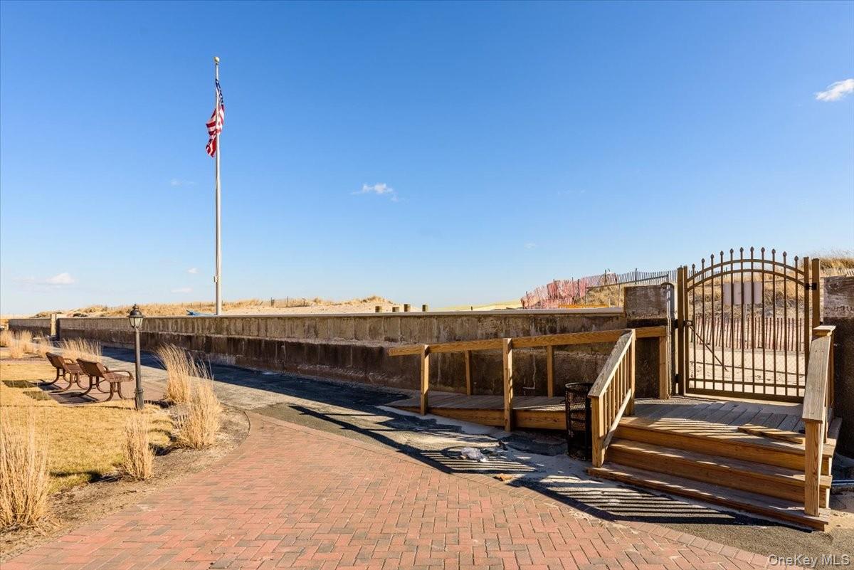 2 Richmond Road, Unit 4F Lido Beach, NY 11561 - Photo 22 of 26 View of patio / terrace with a gate