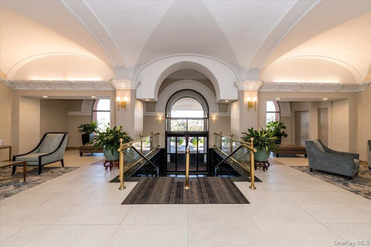 2 Richmond Road, Unit 4F Lido Beach, NY 11561 - Photo 3 of 26 Building lobby with a towering ceiling