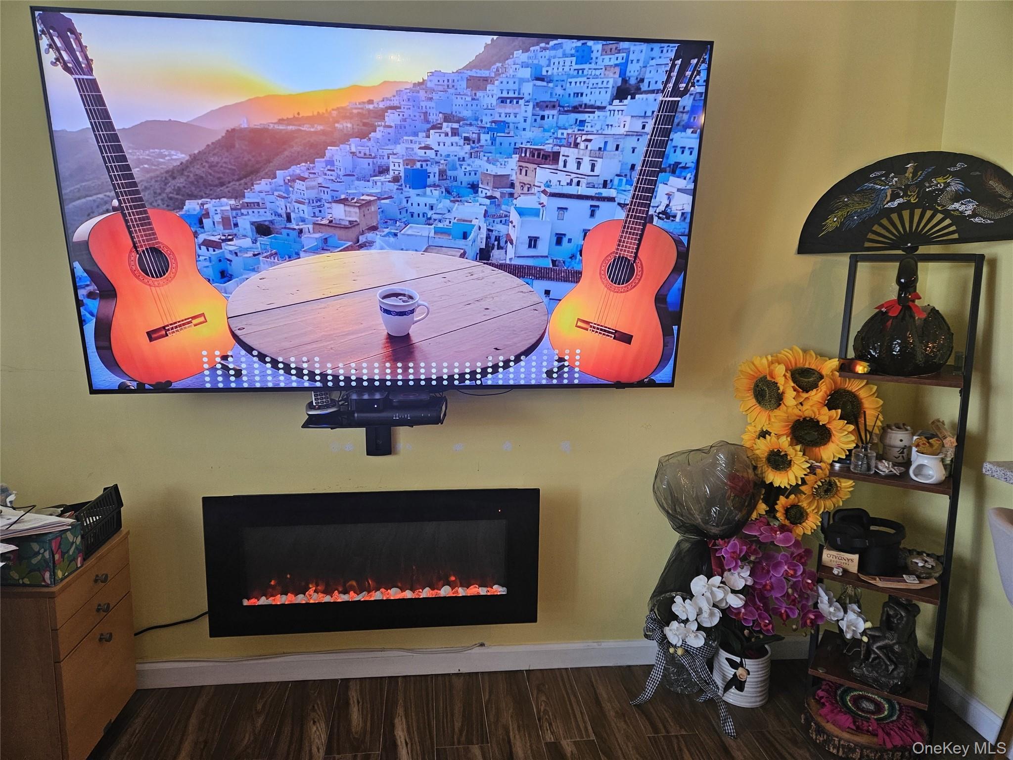 2 Richmond Road, Unit 4F Lido Beach, NY 11561 - Photo 8 of 26 Detailed view of Porcelain tile finished floors and a lit fireplace