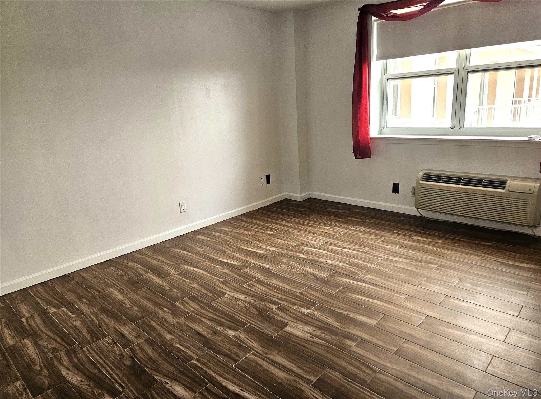 2 Richmond Road, Unit 4F Lido Beach, NY 11561 - Photo 9 of 27 a view of an empty room and window