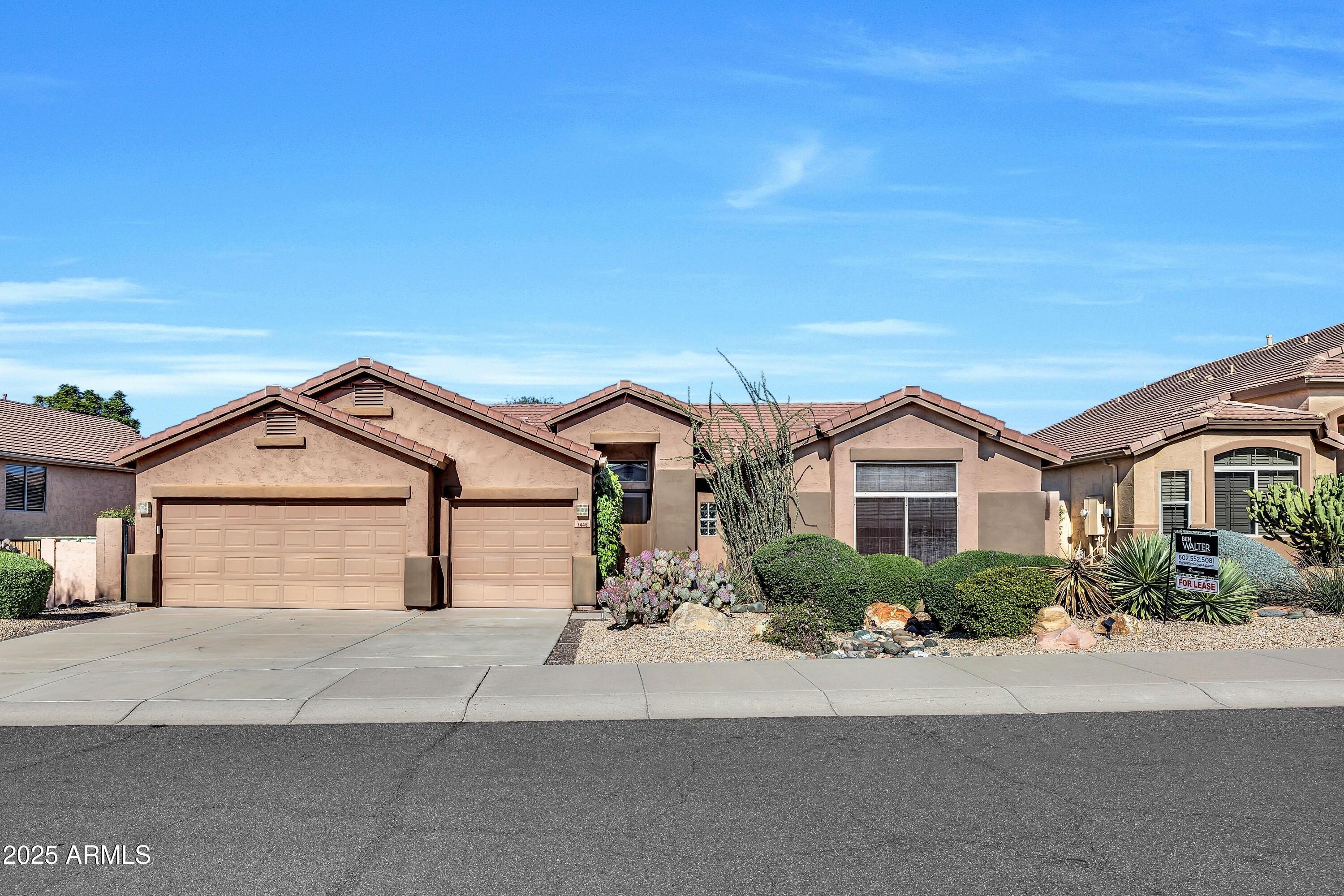 front view of a house with a street