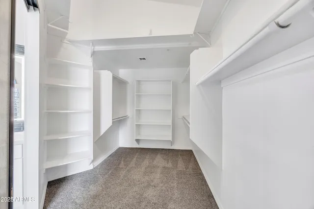 a bathroom with a sink double vanity granite tub and shower