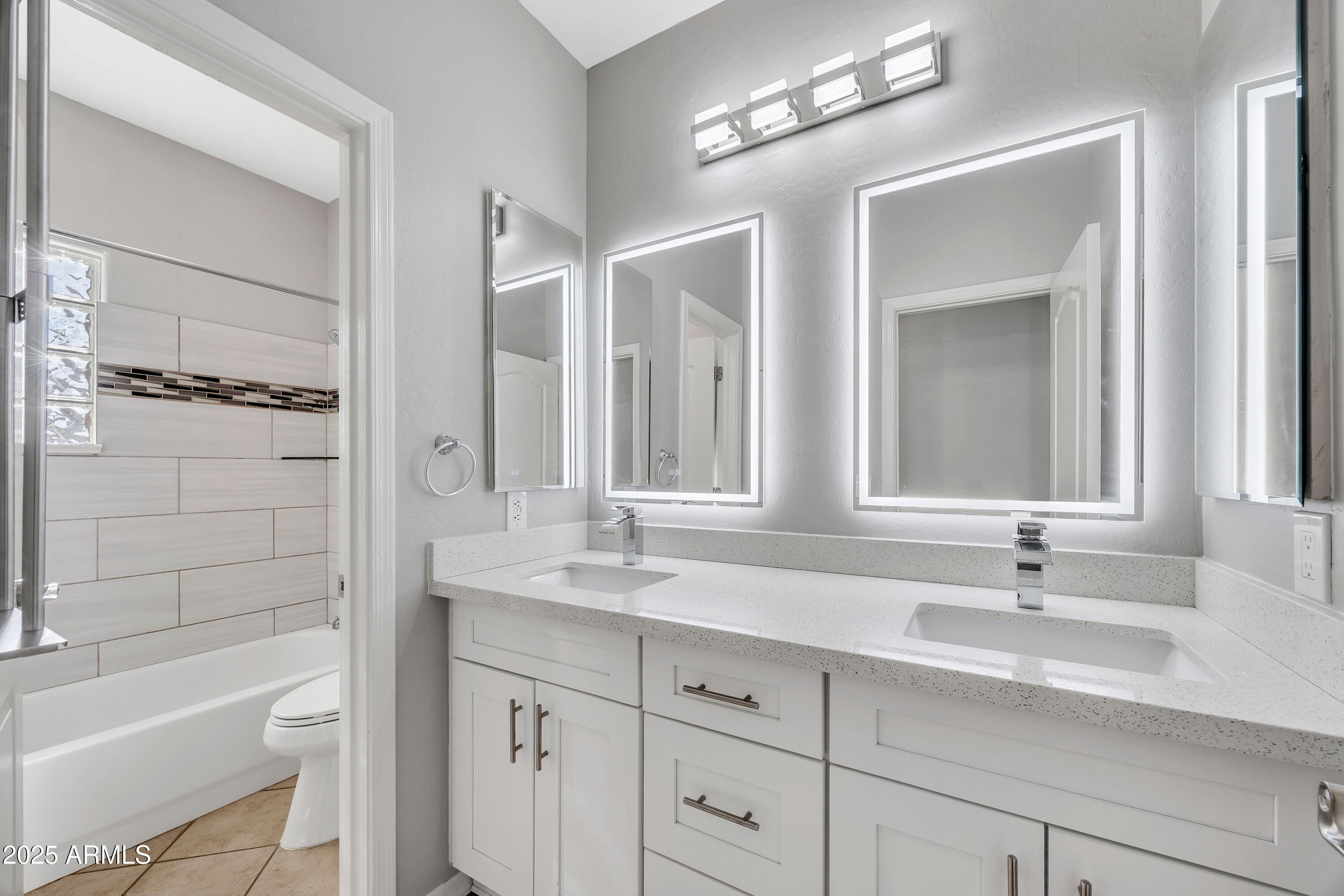 7446 East Glenn Moore Road Scottsdale, AZ 85255 - Photo 16 of 18 a bathroom with a sink double vanity granite tub and shower