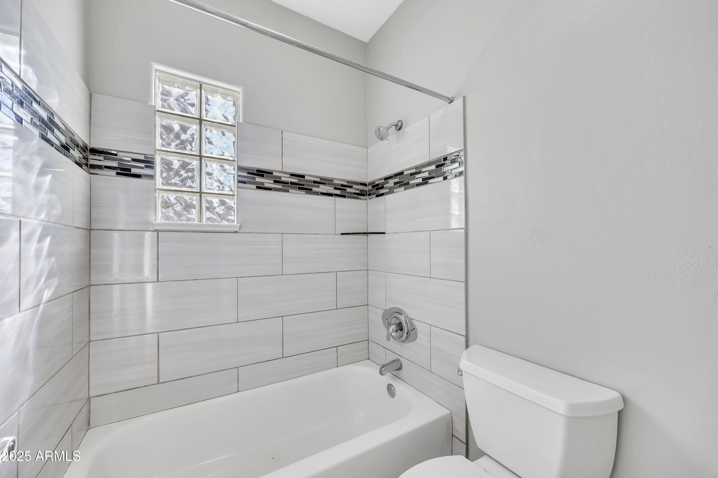 7446 East Glenn Moore Road Scottsdale, AZ 85255 - Photo 17 of 18 a bathroom with a bathtub and shower