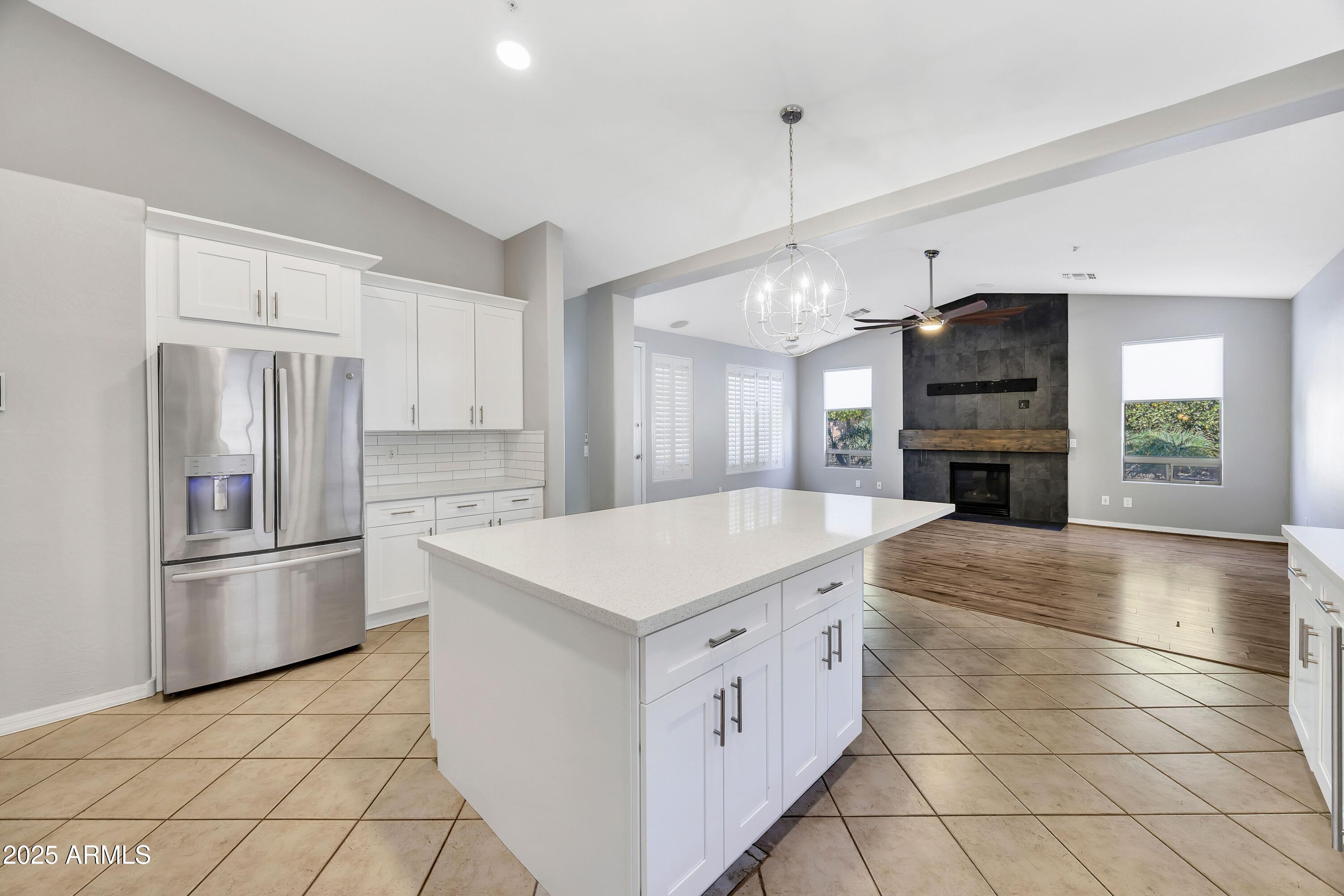 7446 East Glenn Moore Road Scottsdale, AZ 85255 - Photo 5 of 18 a kitchen with stainless steel appliances a refrigerator sink and cabinets
