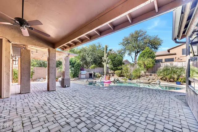 a view of a chairs and table in a patio