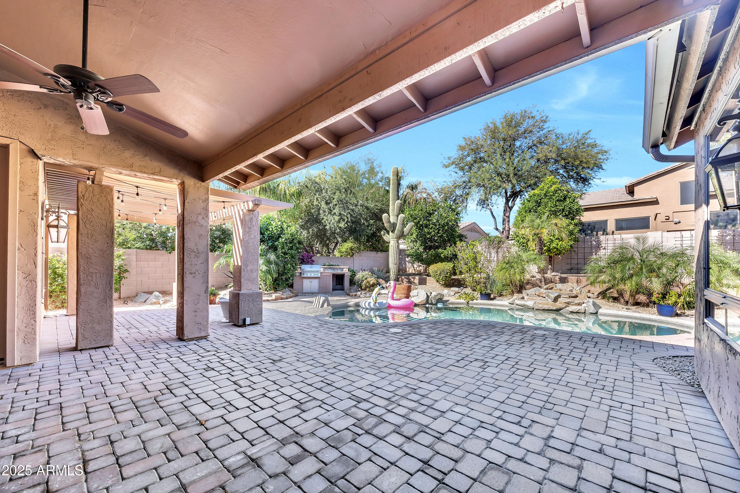 7446 East Glenn Moore Road Scottsdale, AZ 85255 - Photo 8 of 18 a view of a chairs and table in a patio