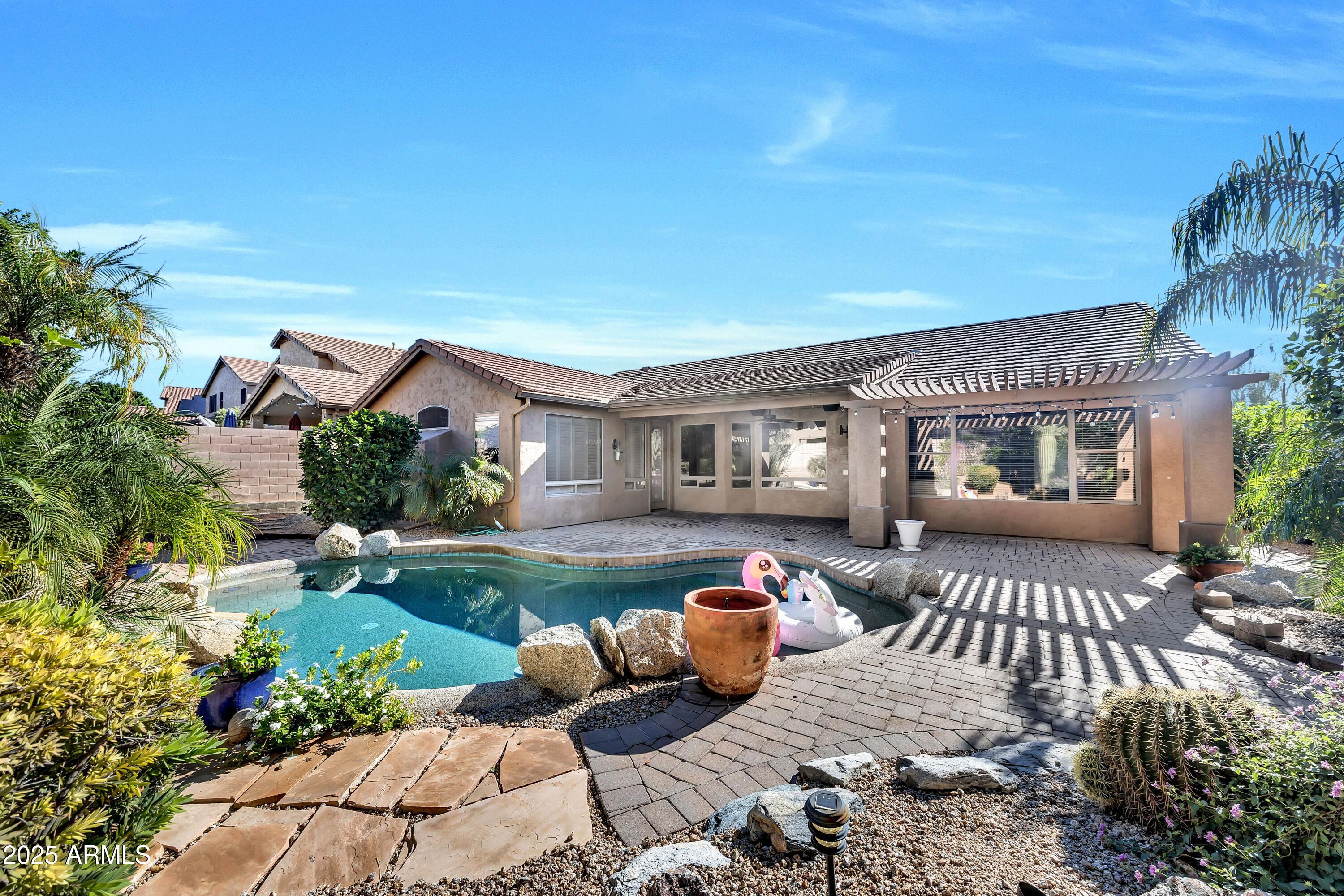 7446 East Glenn Moore Road Scottsdale, AZ 85255 - Photo 9 of 18 a front view of a house with garden