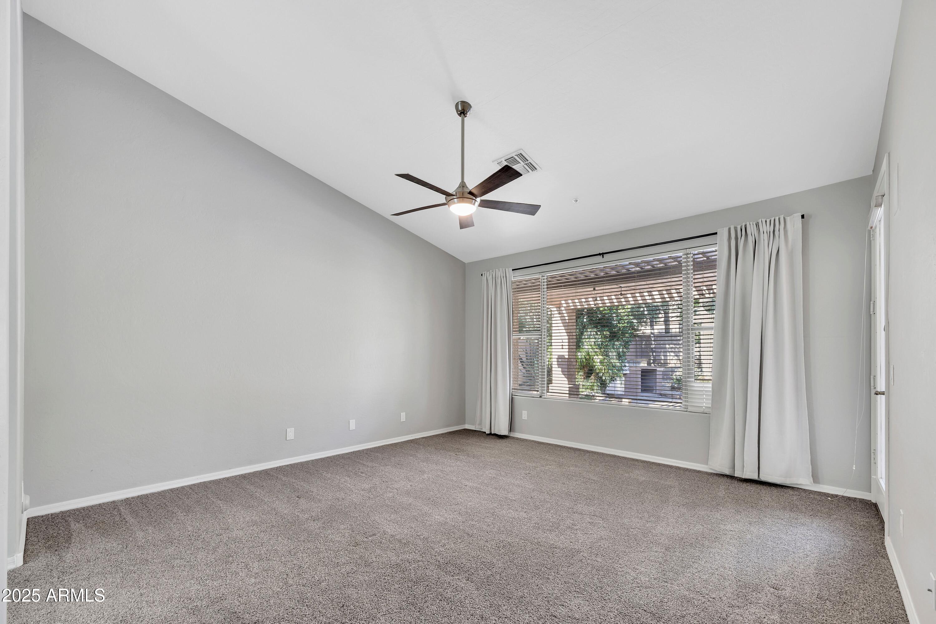 7446 East Glenn Moore Road Scottsdale, AZ 85255 - Photo 10 of 18 a view of room with window and ceiling fan