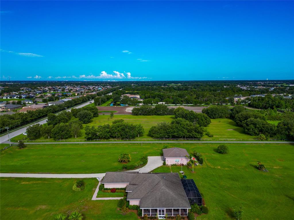 13210 Mulholland Road Parrish, FL 34219 - Photo 16 of 28 a view of a city with a big yard