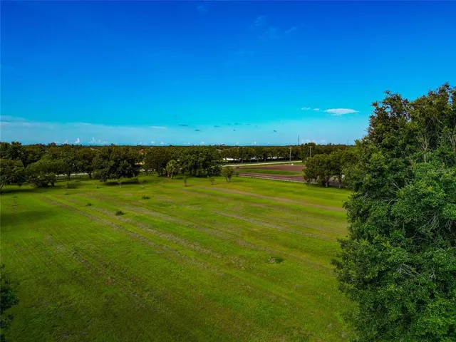 a view of a green field with lots of green space