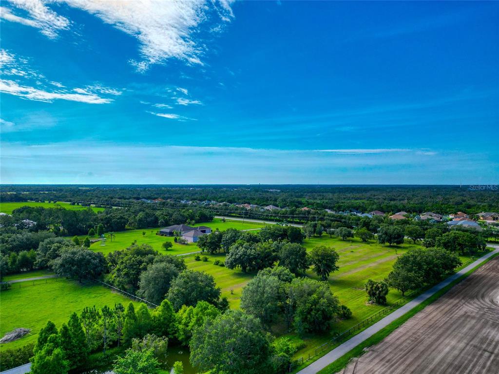 13210 Mulholland Road Parrish, FL 34219 - Photo 20 of 28 a view of a lake with a city
