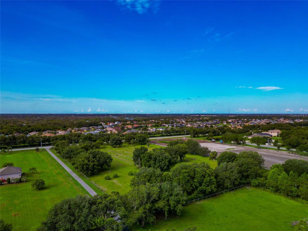 13210 Mulholland Road Parrish, FL 34219 - Photo 21 of 28 a view of a green field with lots of green space