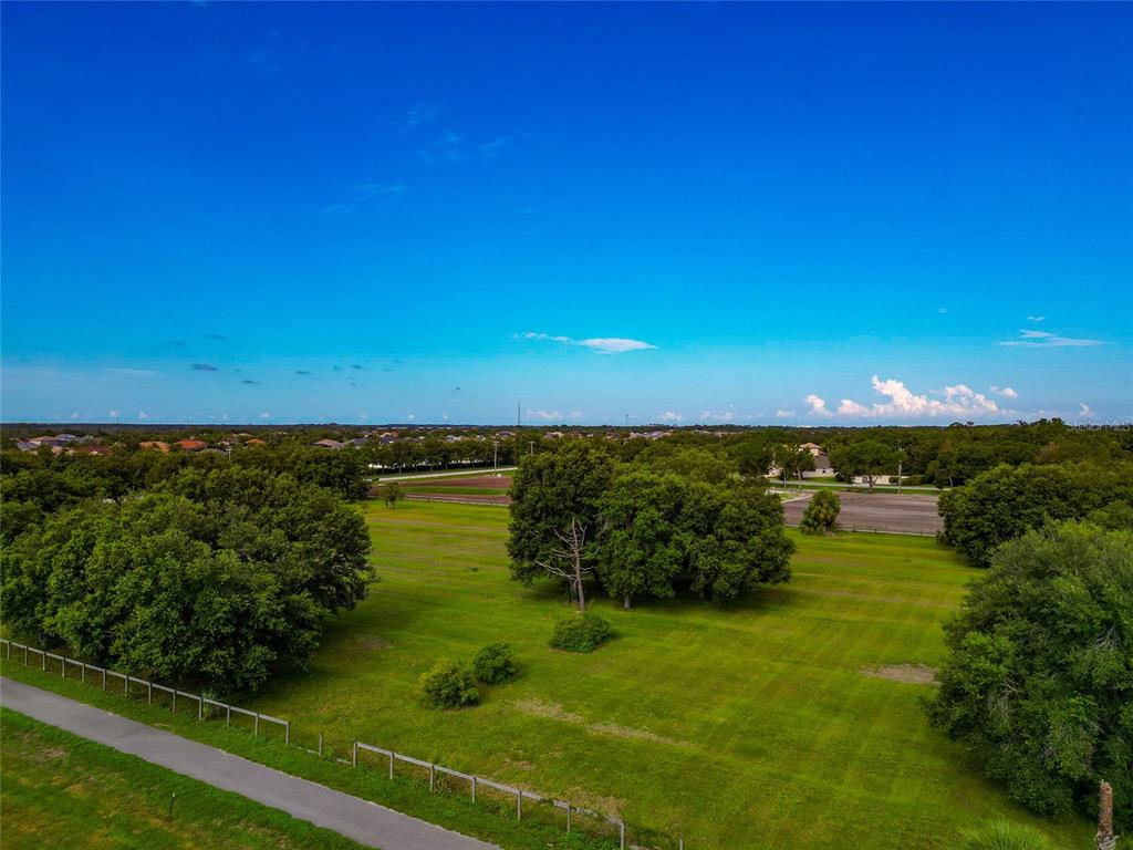 13210 Mulholland Road Parrish, FL 34219 - Photo 23 of 28 a view of a lake with a big yard