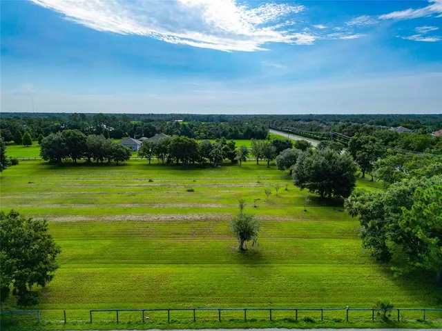a view of a golf course with a yard