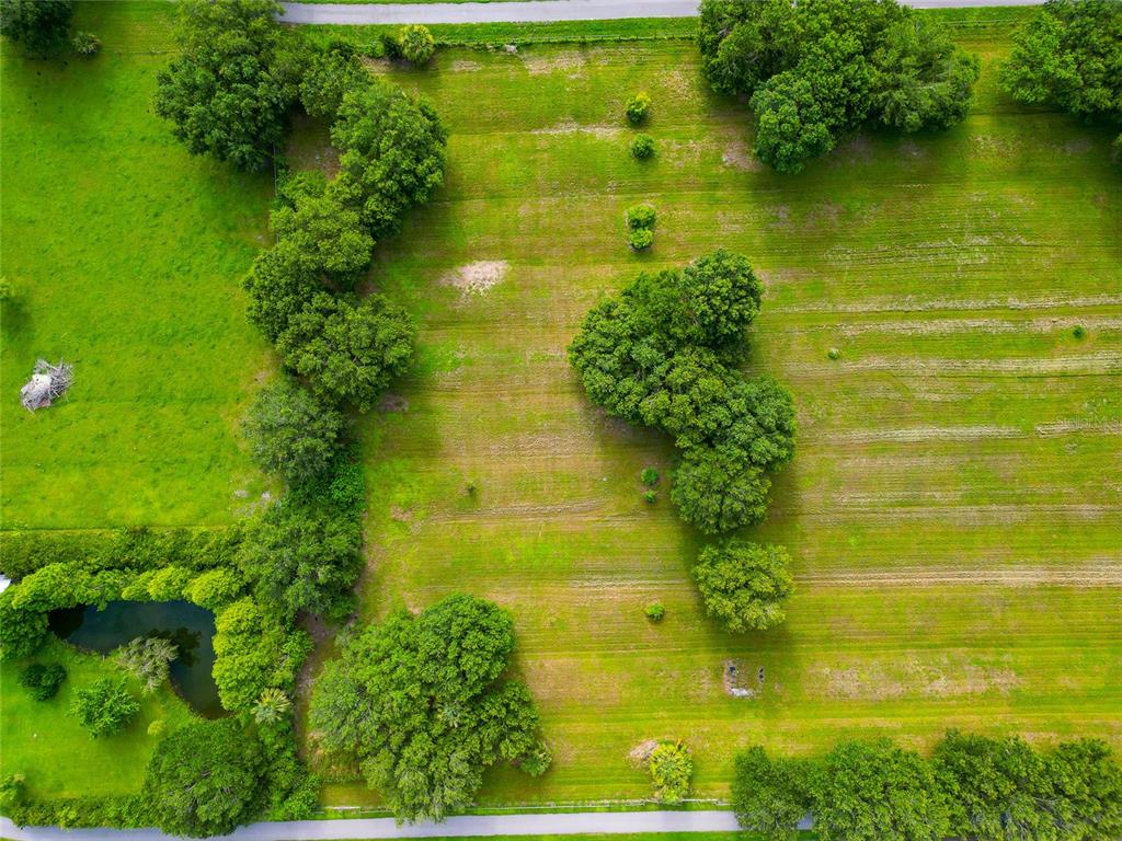 13210 Mulholland Road Parrish, FL 34219 - Photo 7 of 28 a view of a lake with a houses