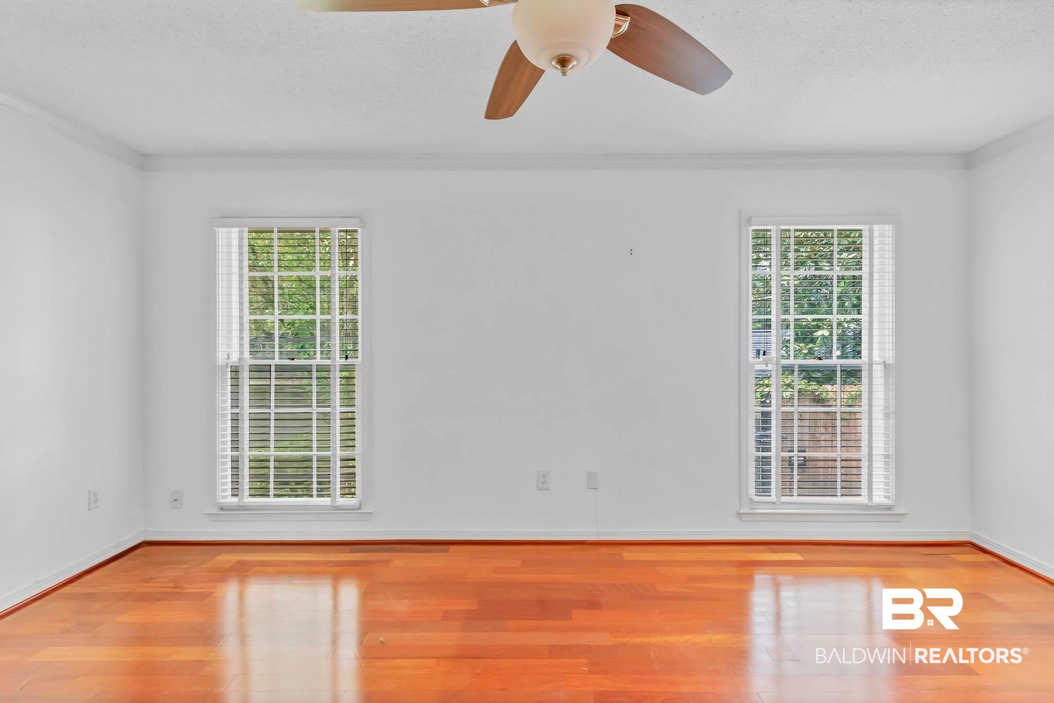 309 West Brandy Run Road Mobile, AL 36608 - Photo 40 of 100 Unfurnished room with wood finished floors, crown molding, and a ceiling fan