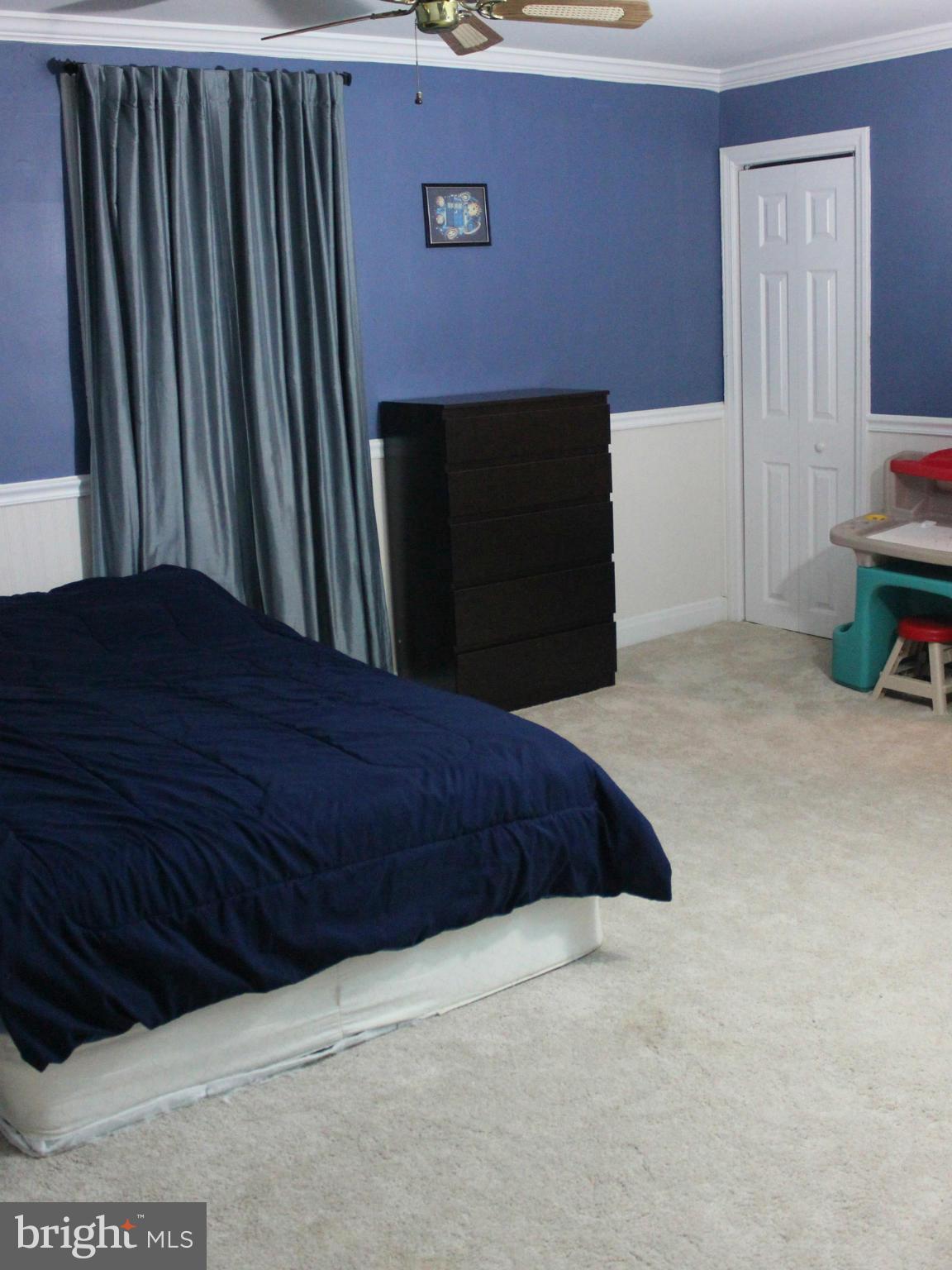 234 Arden Road West Baltimore, MD 21225 - Photo 14 of 26 a bedroom with a bed and a chair
