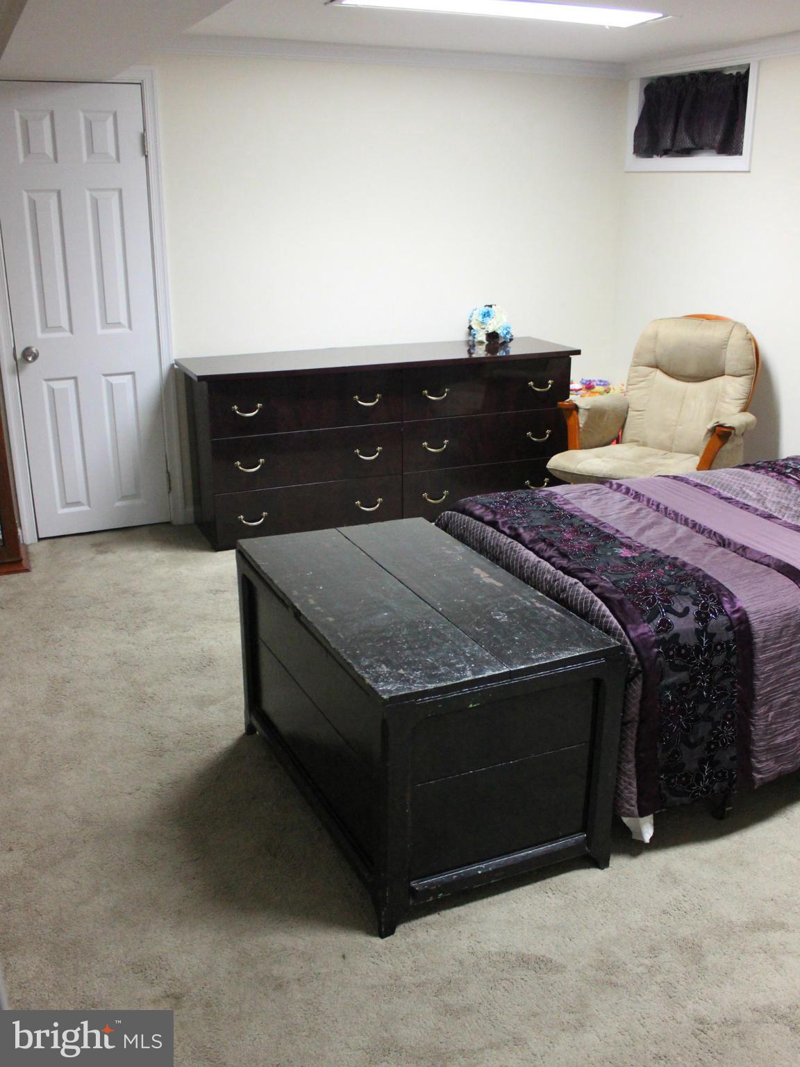 234 Arden Road West Baltimore, MD 21225 - Photo 21 of 26 a bed sitting in a bedroom and dresser