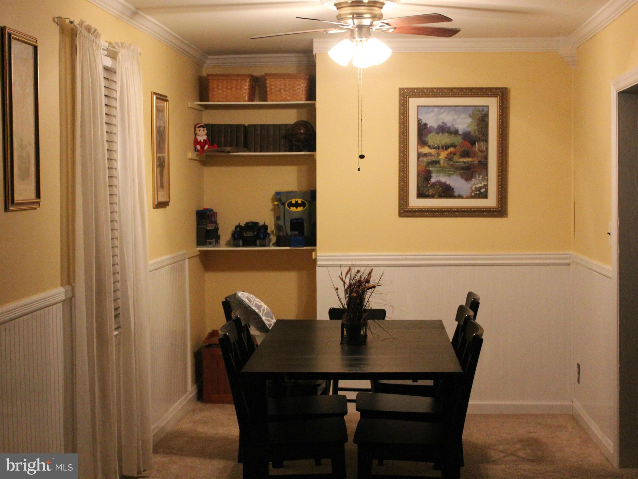 234 Arden Road West Baltimore, MD 21225 - Photo 7 of 26 a view of a dining room with furniture and chandelier