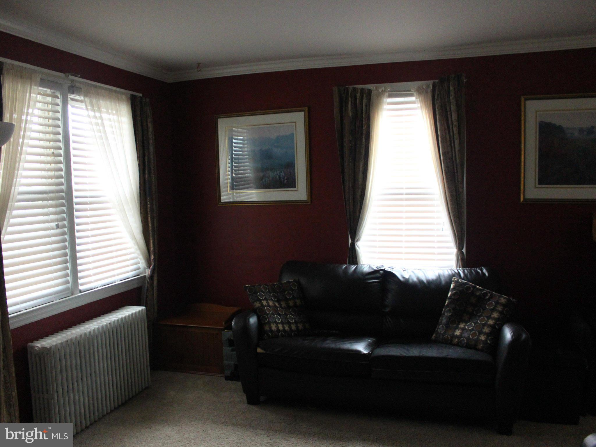 234 Arden Road West Baltimore, MD 21225 - Photo 10 of 26 a living room with furniture and a window