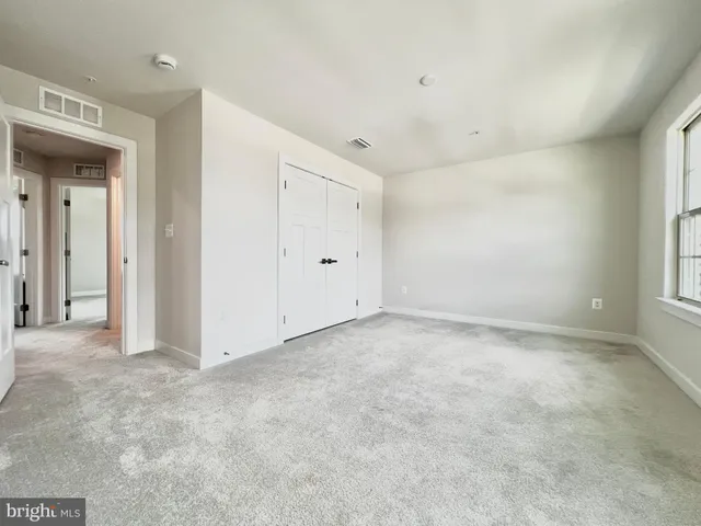 a bathroom with a toilet and a tub