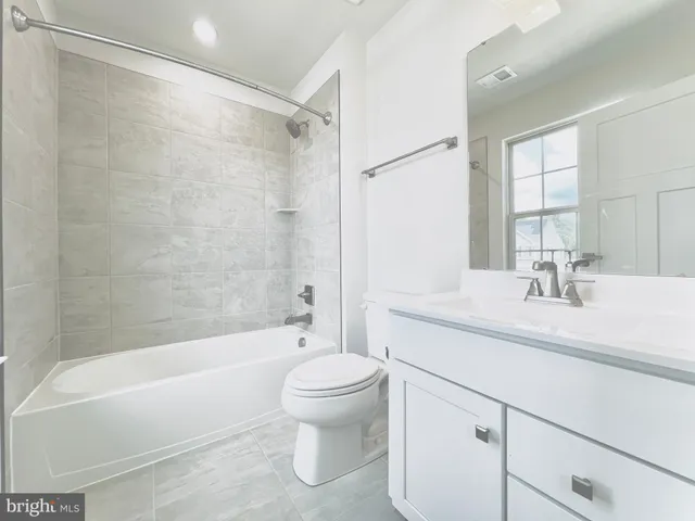 a bedroom with furniture and windows