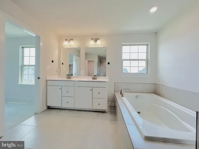 an empty room with a empty space and windows