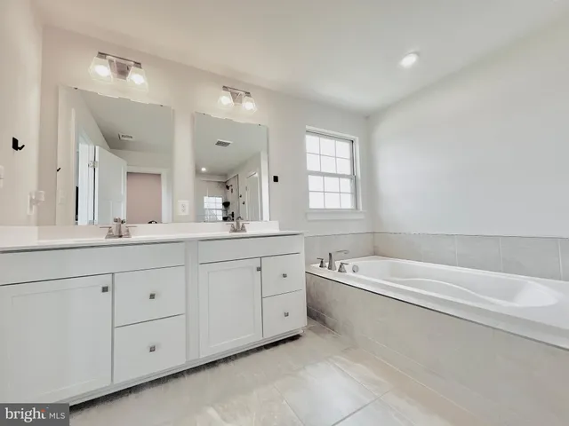 a view of a small space with wooden floor and windows