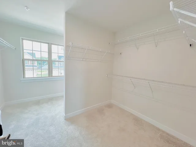 a view of staircase with white walls