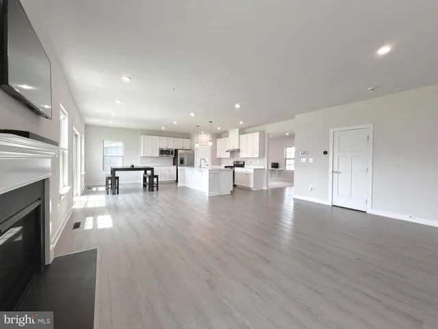 a view of kitchen with furniture and wooden floor