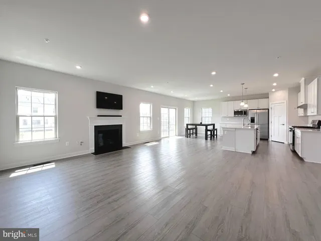 a view of kitchen with furniture and wooden floor