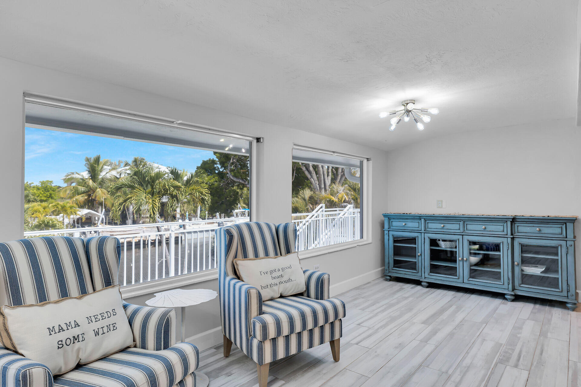 853 Ellen Drive Key Largo, FL 33037 - Photo 11 of 42 a living room with furniture and a floor to ceiling window