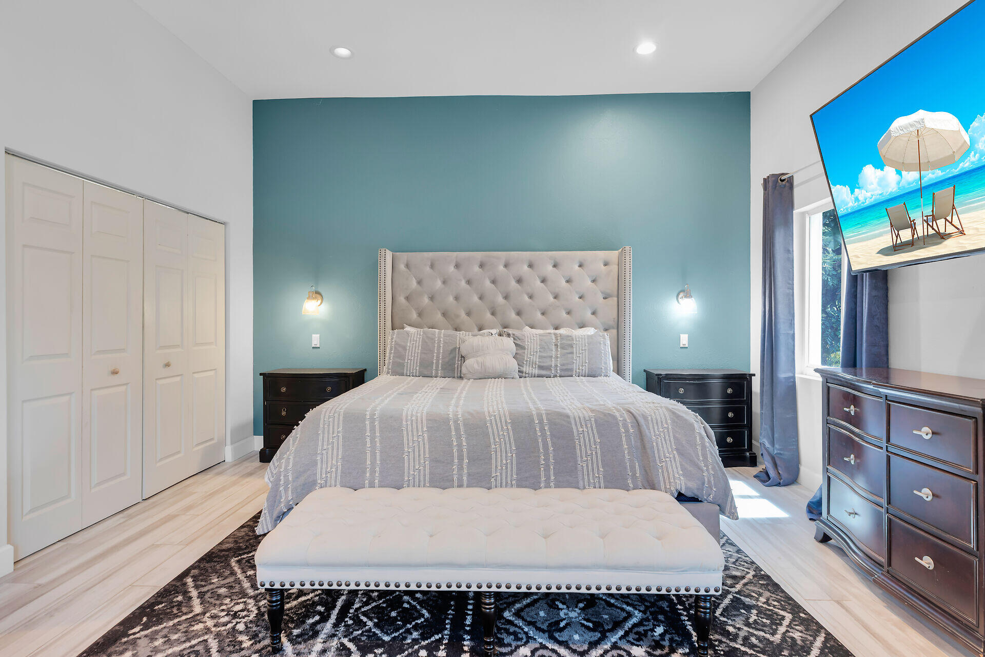 853 Ellen Drive Key Largo, FL 33037 - Photo 13 of 42 a bedroom with a bed and a lamp on dresser