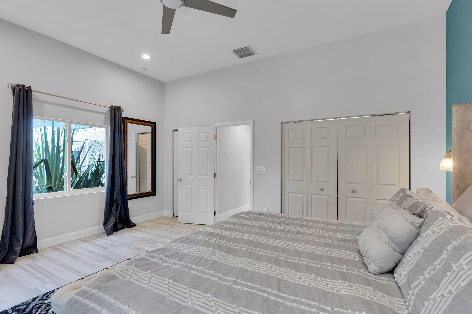 853 Ellen Drive Key Largo, FL 33037 - Photo 15 of 42 a bedroom with a large bed and a large window