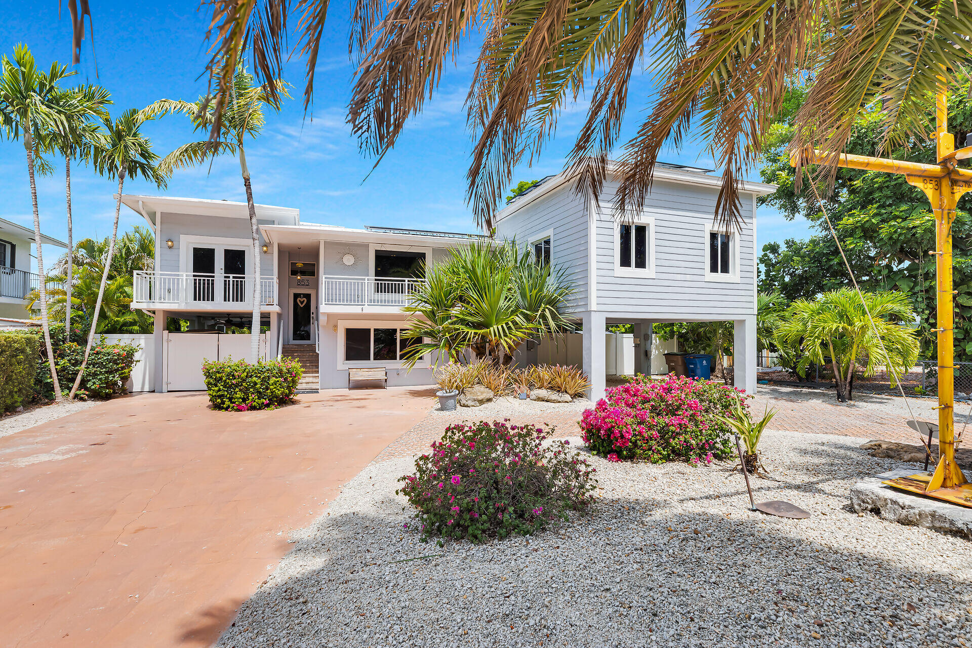 853 Ellen Drive Key Largo, FL 33037 - Photo 2 of 42 a front view of a house with yard