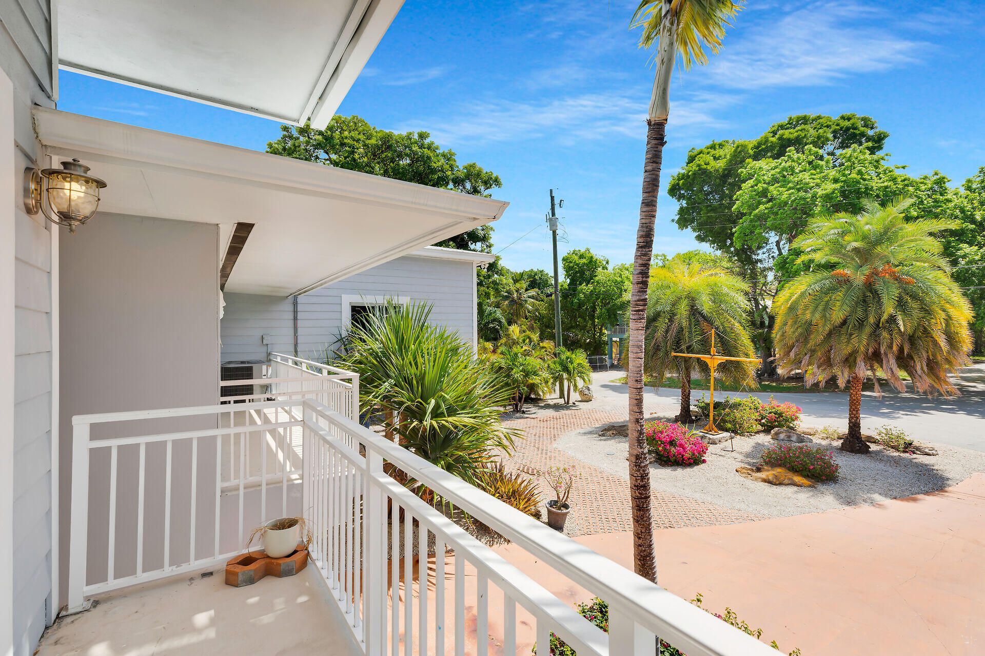 853 Ellen Drive Key Largo, FL 33037 - Photo 21 of 42 a view of a balcony and potted plants