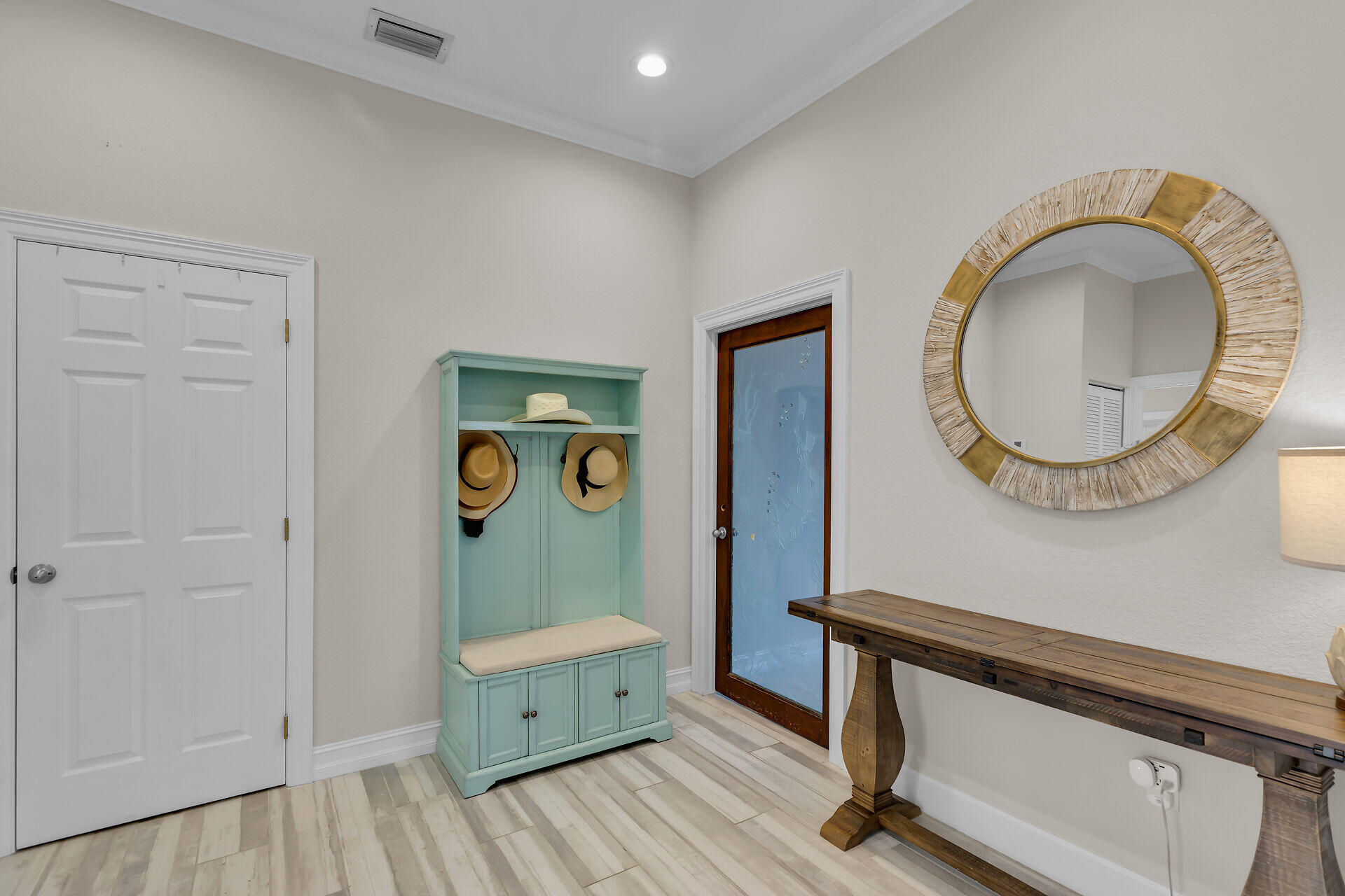 853 Ellen Drive Key Largo, FL 33037 - Photo 22 of 42 a room with painting on the wall and a mirror