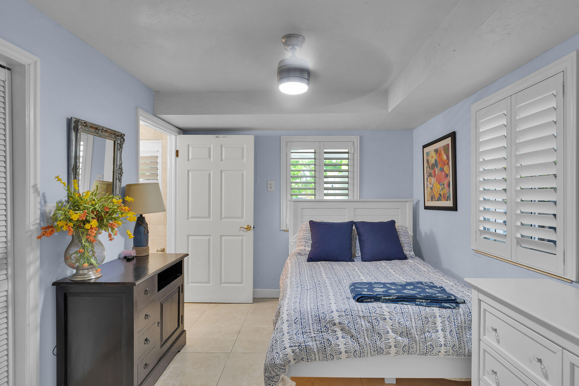 853 Ellen Drive Key Largo, FL 33037 - Photo 29 of 42 a bedroom with a bed and a television