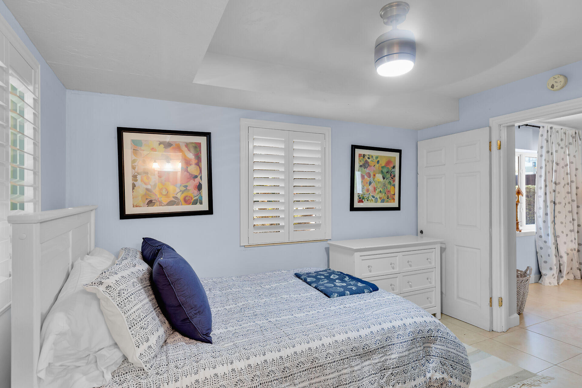 853 Ellen Drive Key Largo, FL 33037 - Photo 30 of 42 a bedroom with a bed and a window