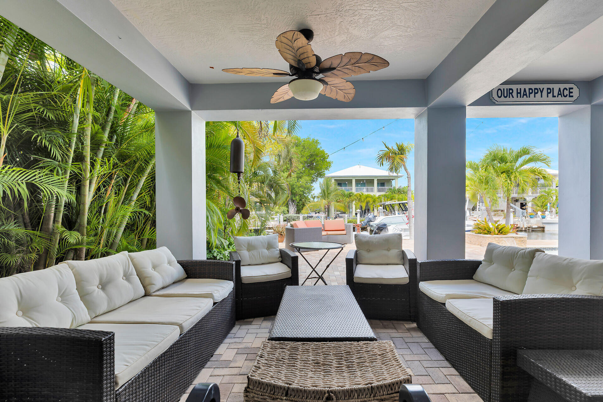 853 Ellen Drive Key Largo, FL 33037 - Photo 36 of 42 a living room with patio fireplace furniture and a large window