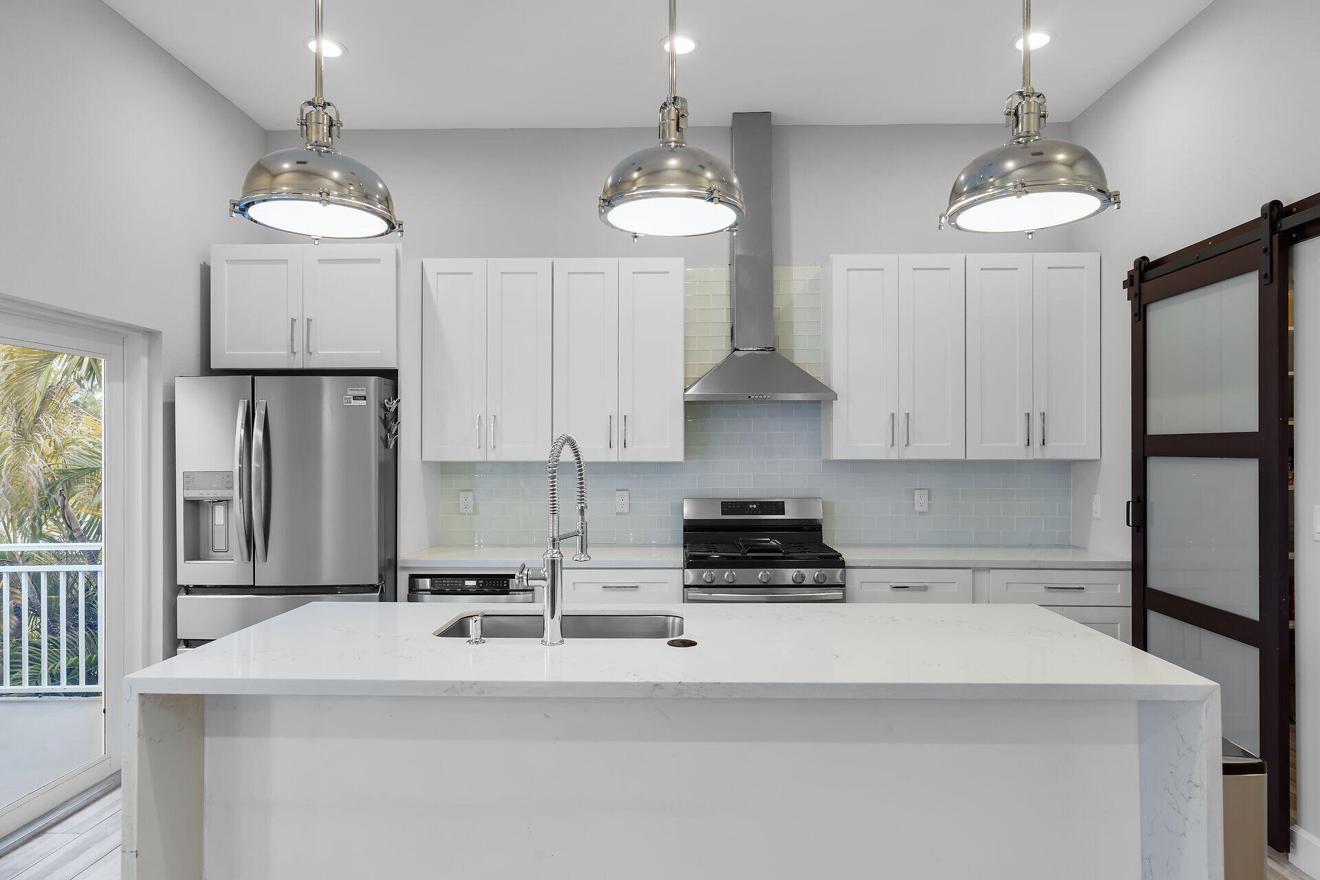 853 Ellen Drive Key Largo, FL 33037 - Photo 4 of 42 a kitchen with stainless steel appliances granite countertop a sink stove and refrigerator