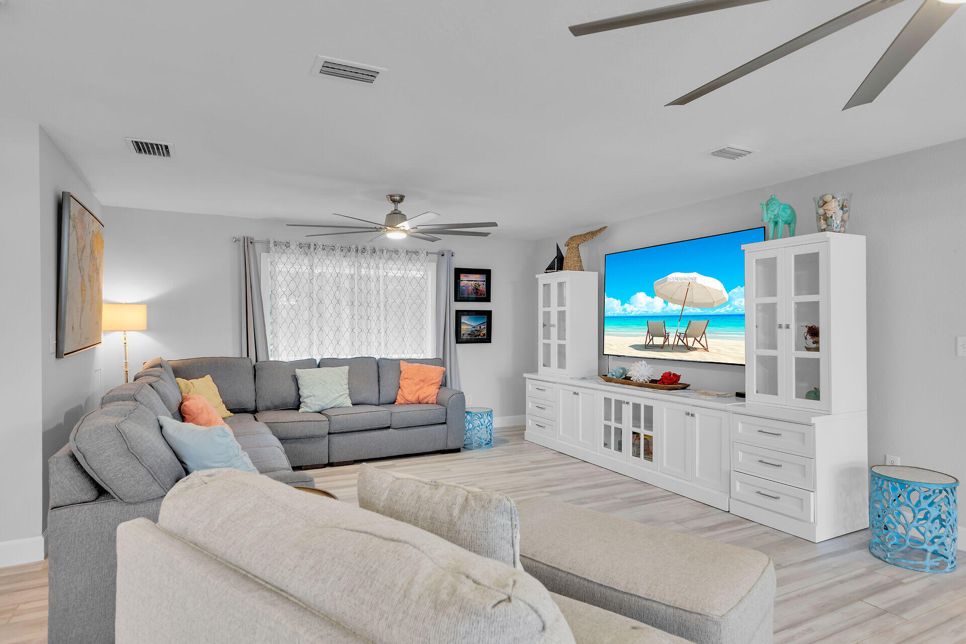 853 Ellen Drive Key Largo, FL 33037 - Photo 9 of 42 a living room with furniture a flat screen tv and a refrigerator