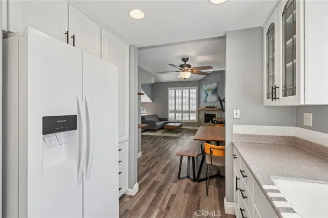 a view of a kitchen from the hallway