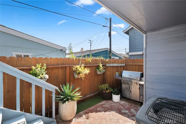 a view of a porch with potted plants