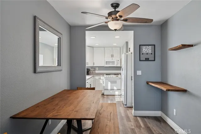 a view of a kitchen with a table and cabinets