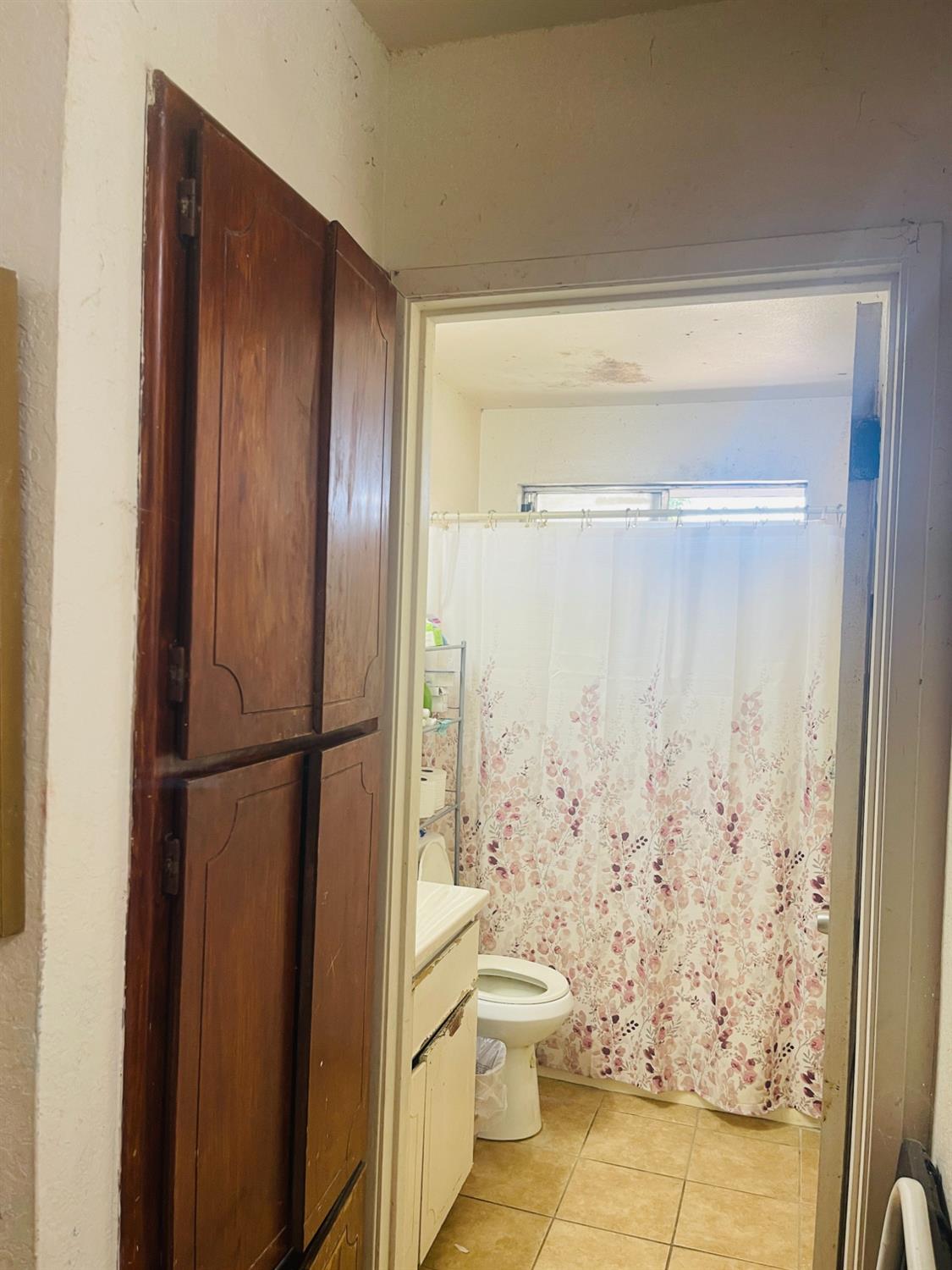 17260 Rodeo Drive Madera, CA 93638 - Photo 12 of 19 a bathroom with a shower and a toilet