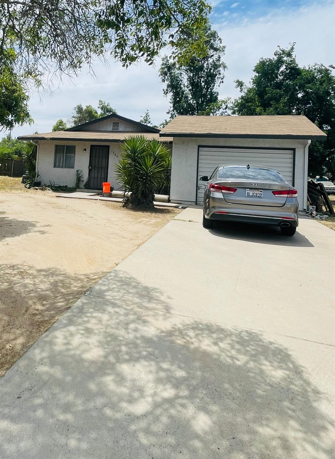 17260 Rodeo Drive Madera, CA 93638 - Photo 2 of 19 a view of house that has a car parked in front of it
