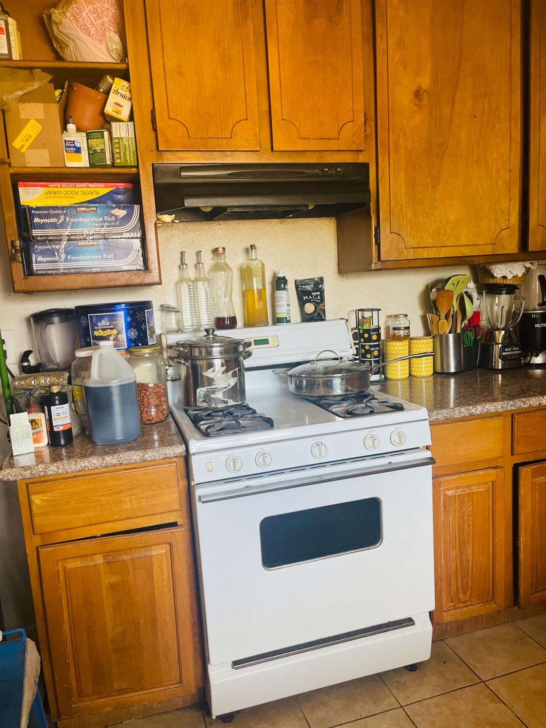 17260 Rodeo Drive Madera, CA 93638 - Photo 8 of 19 a kitchen with a stove top oven and cabinets